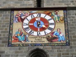 Clock on church with latin text